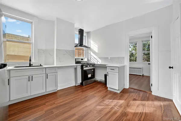 a kitchen with a refrigerator and a sink