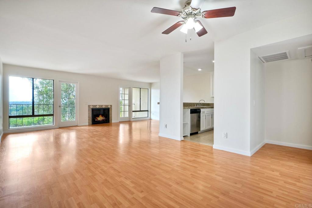 2251 Altisma Way, Unit 202 Carlsbad, CA 92009 - Photo 21 of 35 a view of empty room with wooden floor and fan