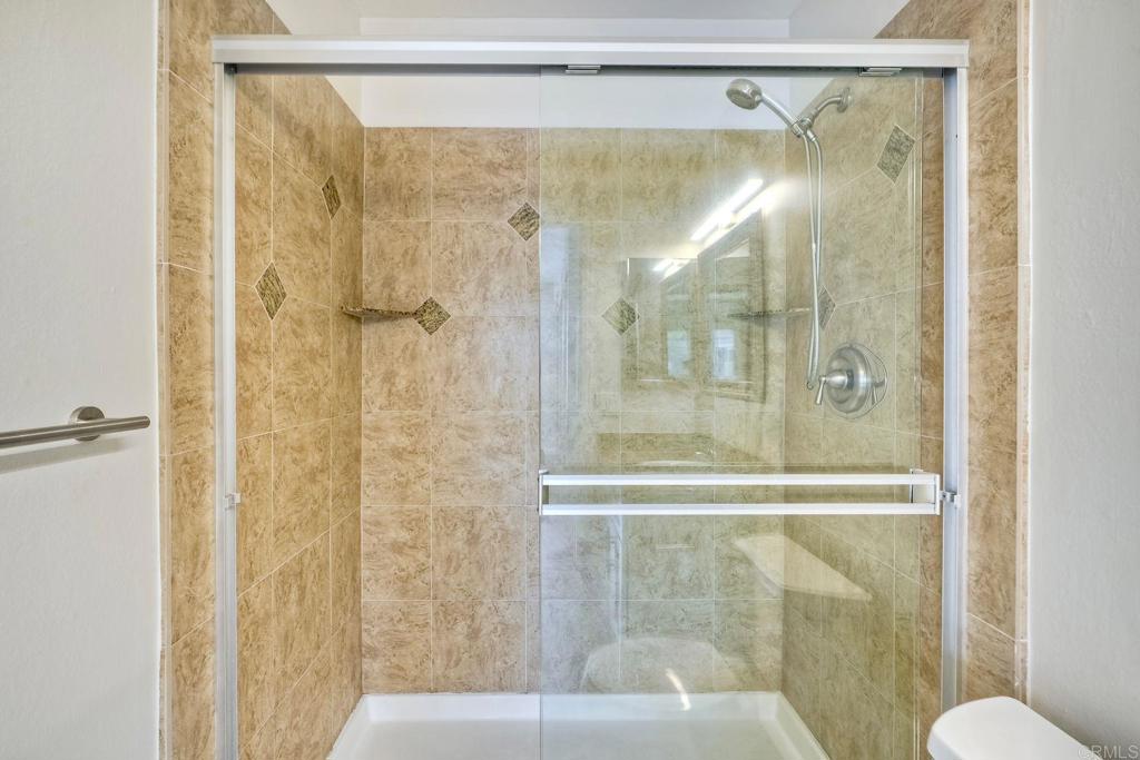 2251 Altisma Way, Unit 202 Carlsbad, CA 92009 - Photo 28 of 35 a bathroom with a shower