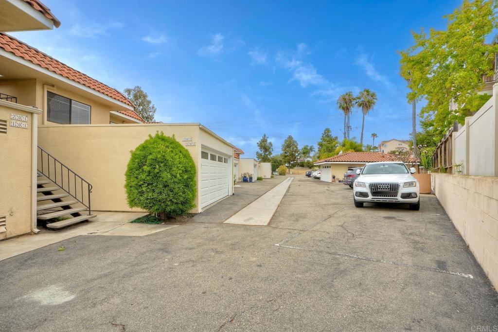 2251 Altisma Way, Unit 202 Carlsbad, CA 92009 - Photo 35 of 35 a view of car parked in front of house