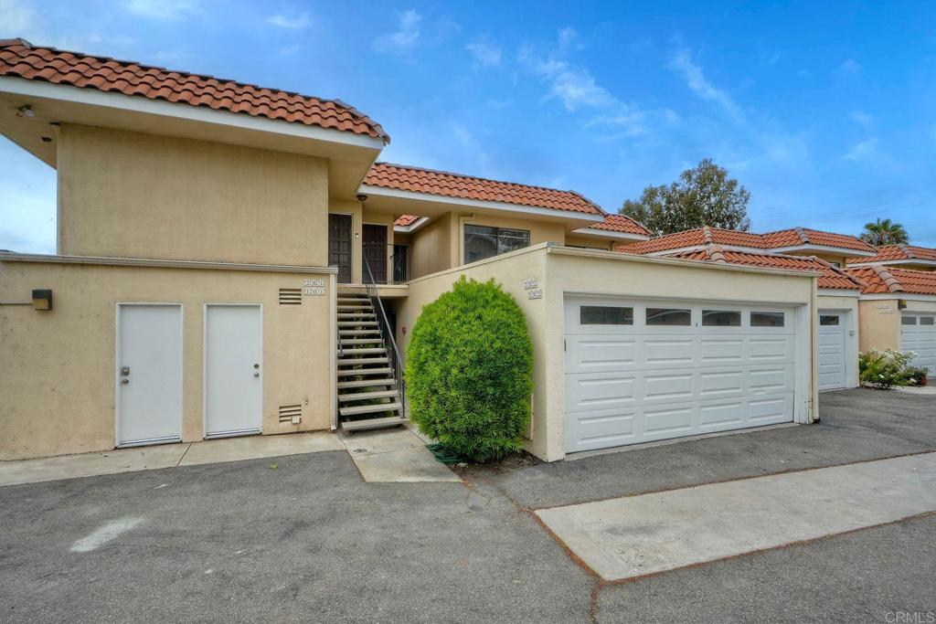 2251 Altisma Way, Unit 202 Carlsbad, CA 92009 - Photo 4 of 35 a view of a house with a garage