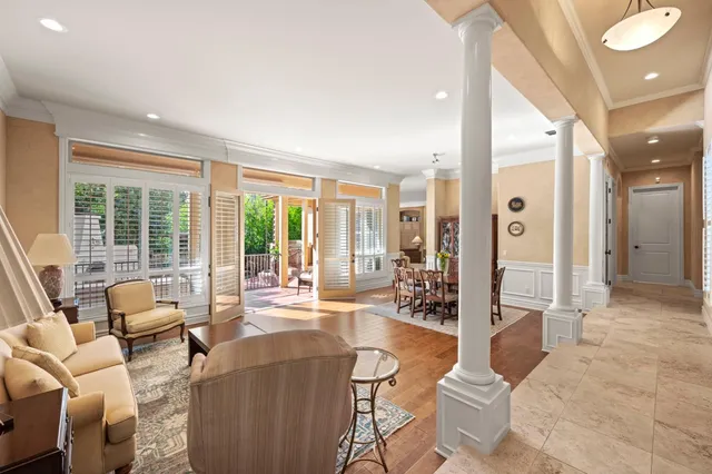 a living room with furniture ceiling fan and a rug