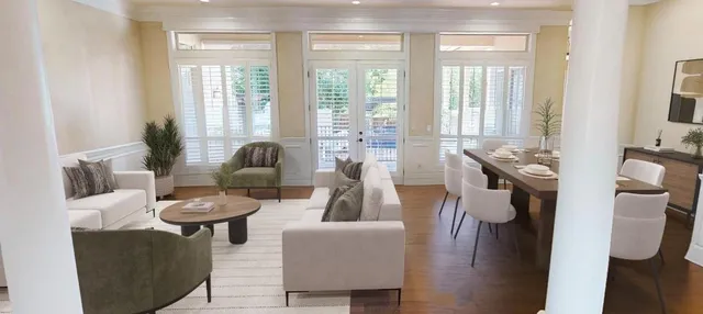 a bedroom with a bed a large window and walk in closet