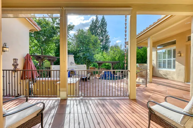 a view of a balcony with wooden floor