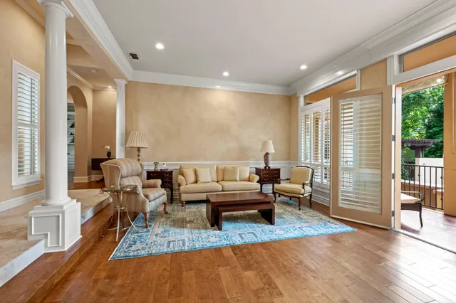 a view of a dining room with furniture window and wooden floor