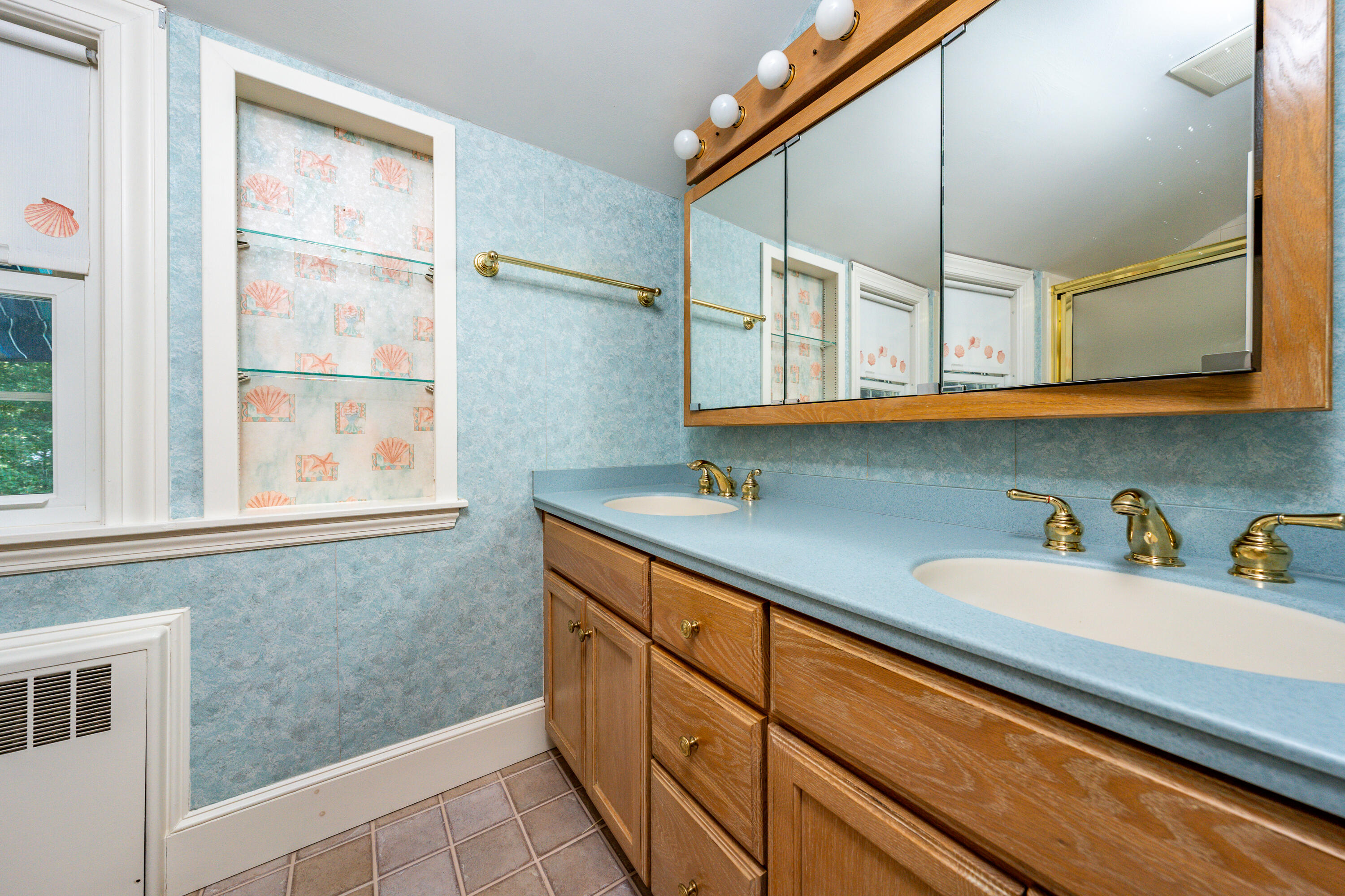 115 Old Stage Road Centerville, MA 02632 - Photo 20 of 32 a kitchen with stainless steel appliances granite countertop a sink and cabinets