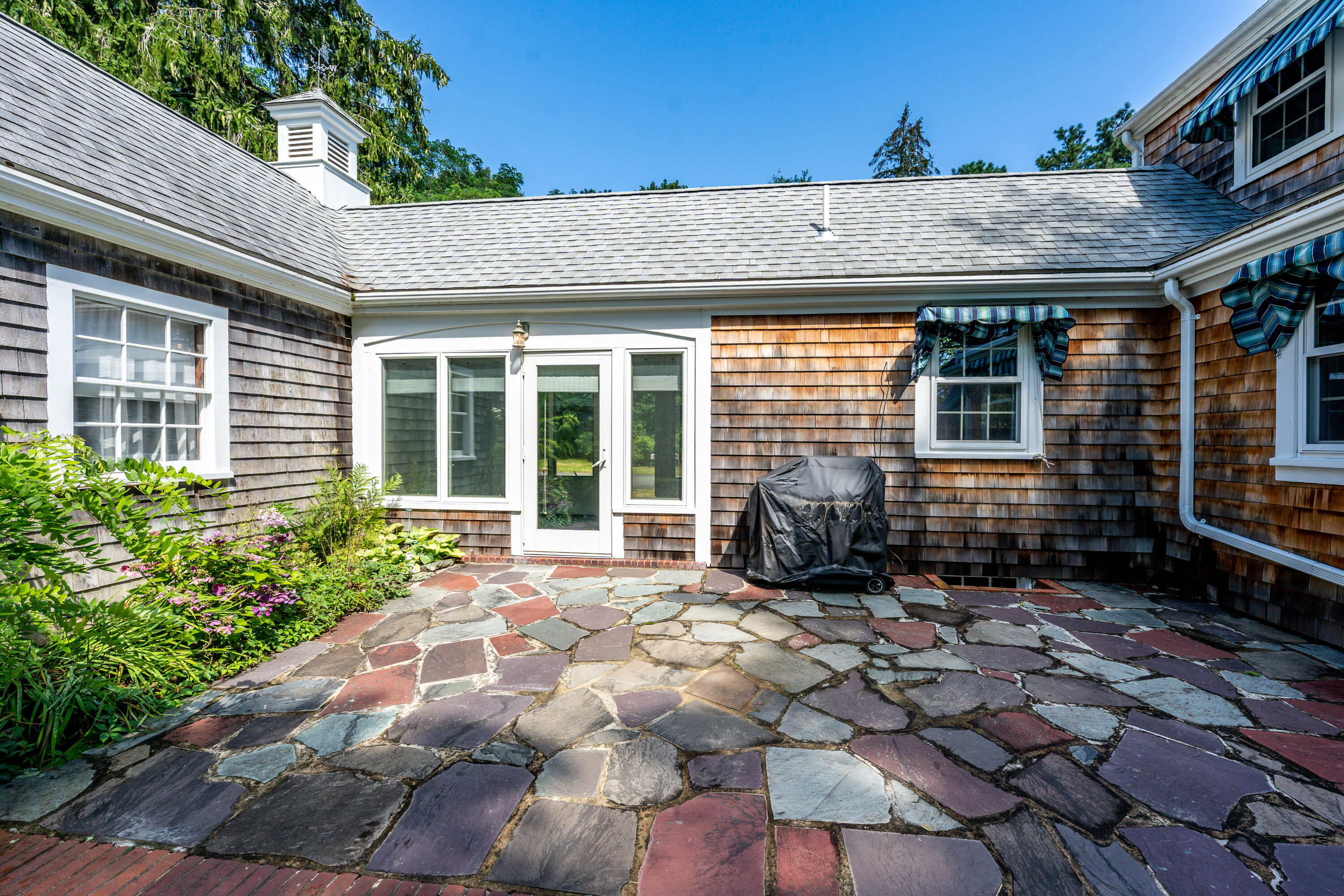 115 Old Stage Road Centerville, MA 02632 - Photo 26 of 32 a view of a house with a patio