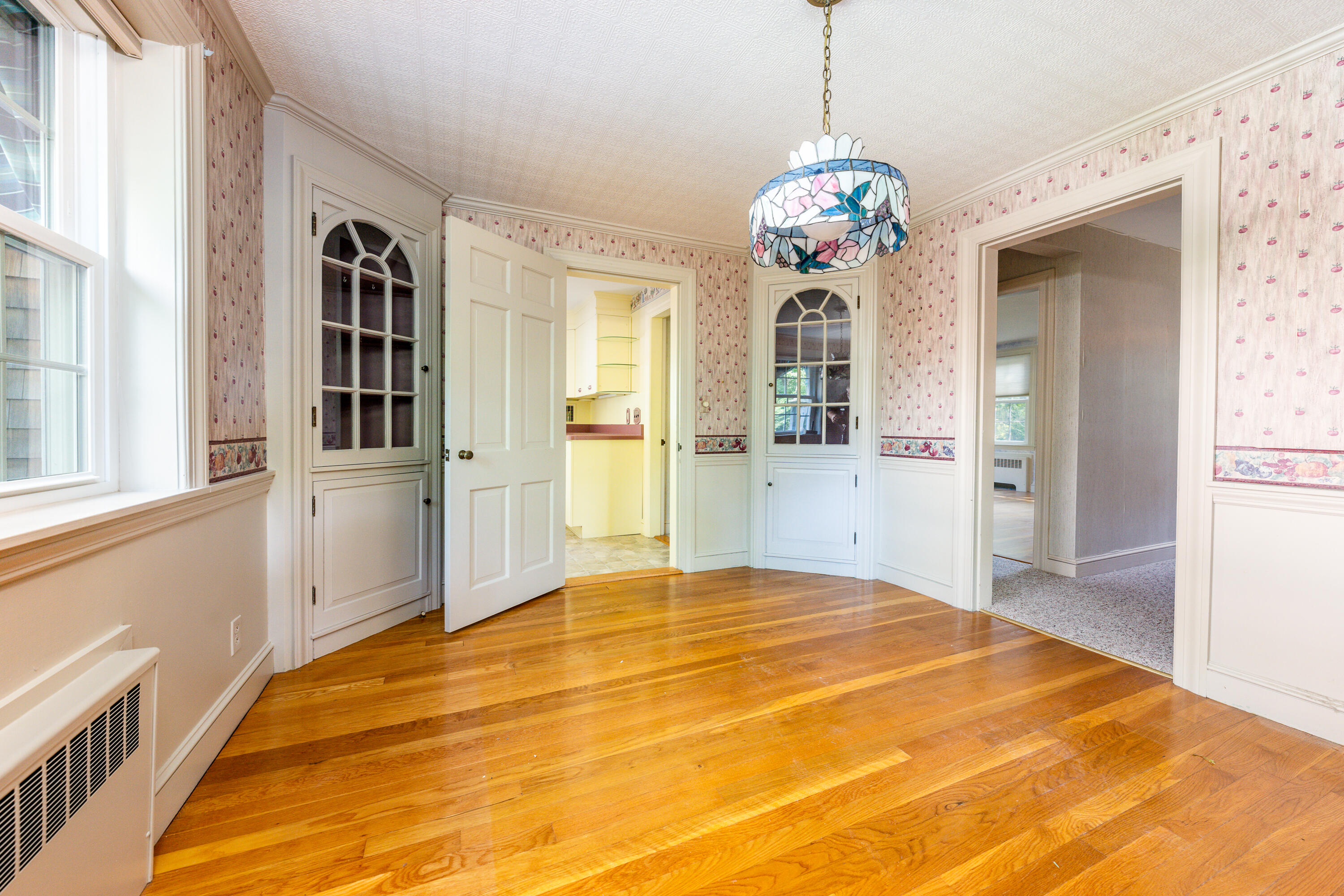 115 Old Stage Road Centerville, MA 02632 - Photo 7 of 32 a bedroom with a bed and a chandelier