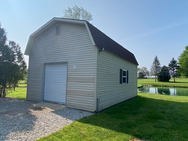 8274 Ruff Road West Salem, OH 44287 - Photo 3 of 30 View of property exterior with a water view, a yard, and a garage