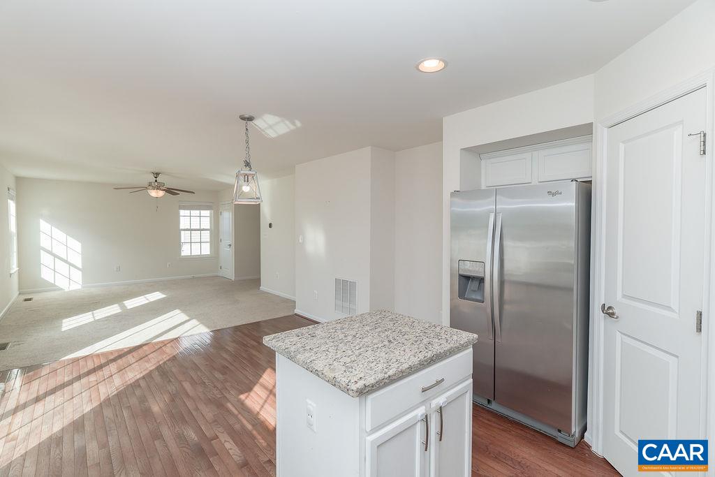 258 Larchmont Circle Ruckersville, VA 22968 - Photo 12 of 40 a kitchen with a refrigerator and countertop