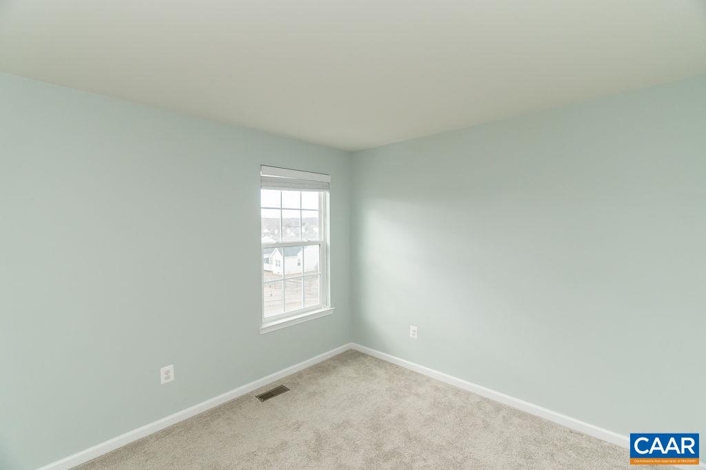 258 Larchmont Circle Ruckersville, VA 22968 - Photo 19 of 40 an empty room with windows