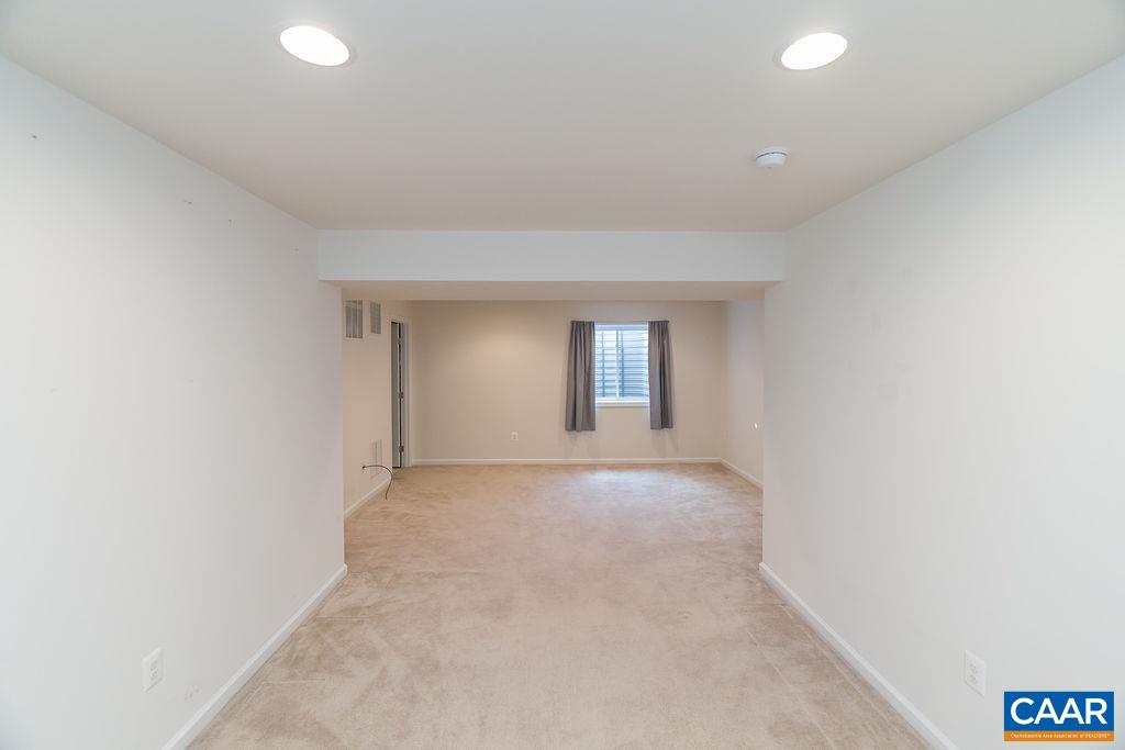 258 Larchmont Circle Ruckersville, VA 22968 - Photo 27 of 40 an empty room with windows and entrance