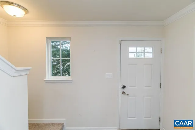a view of an empty room with a window
