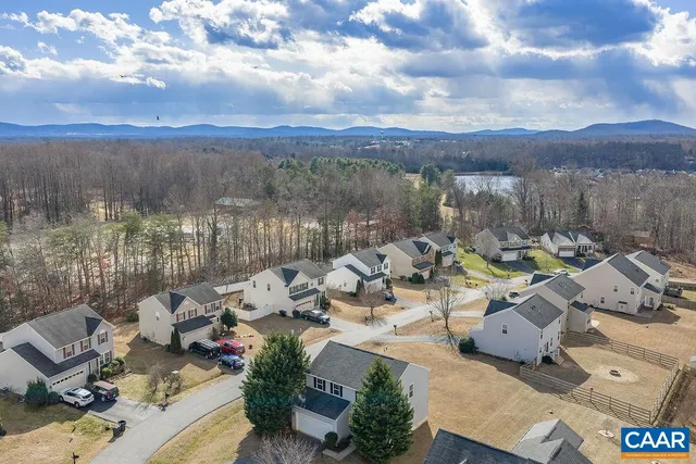 an aerial view of a house with a garden