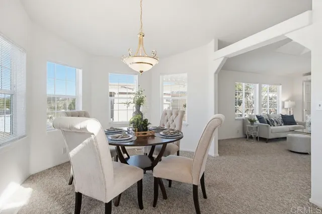 a view of a dining room with furniture window and outside view
