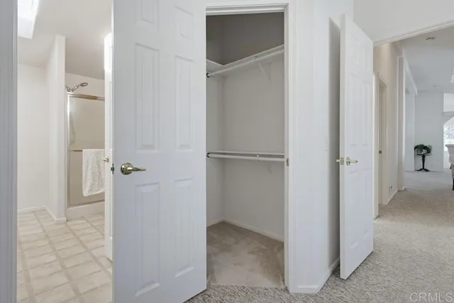 a bathroom with a shower and a tub