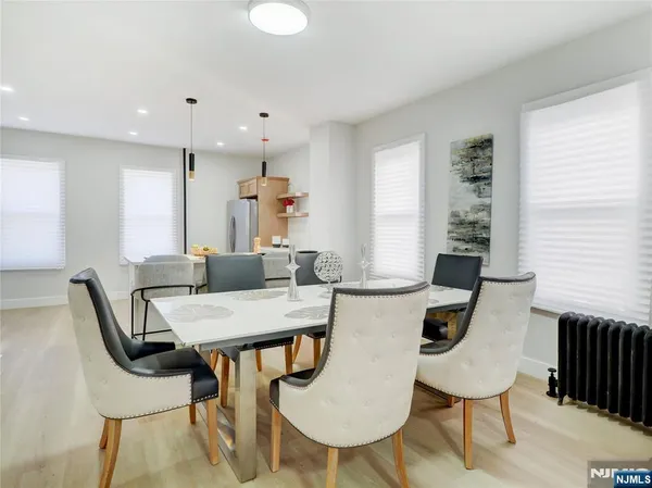 a view of a dining room with furniture and window