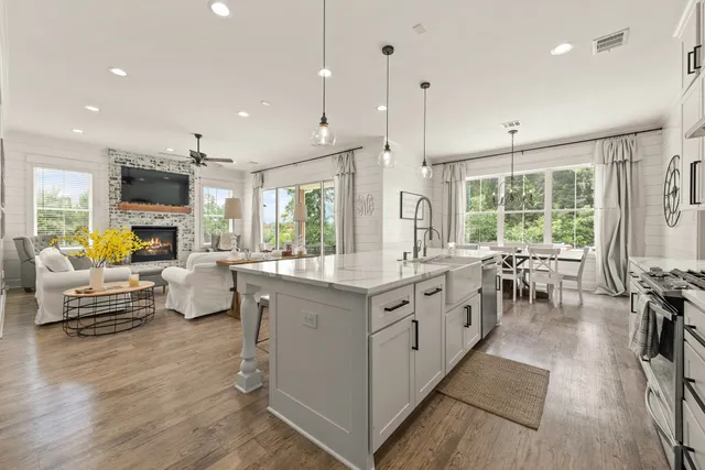 a large kitchen with stainless steel appliances lots of counter top space