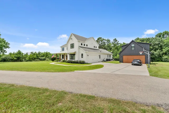 a view of a house with a big yard