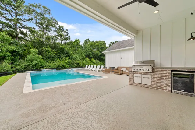 a view of a kitchen with stove and refrigerator