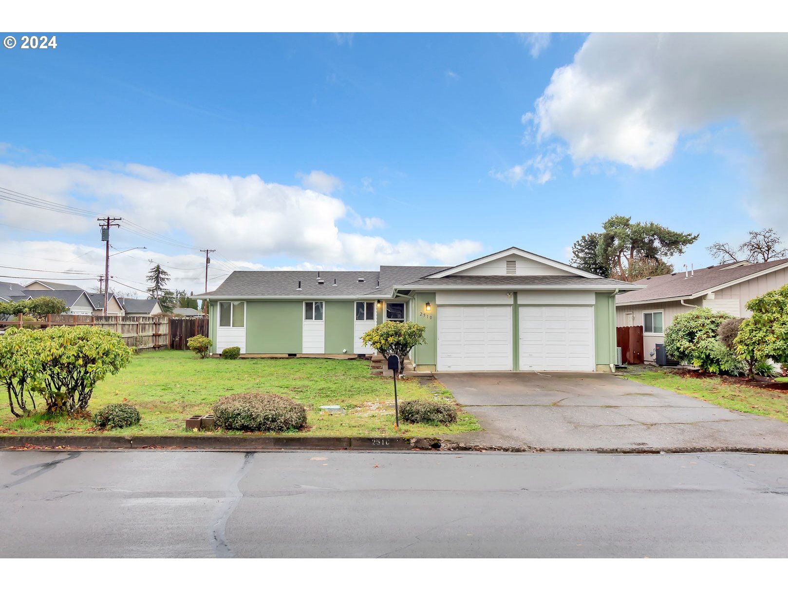 2510 20th Street Springfield, OR 97477 - Photo 1 of 21 a front view of a house with a garden and yard