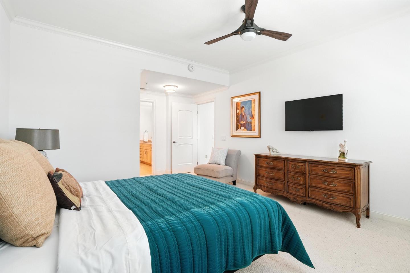 10 Crystal Springs Road, Unit 1507 San Mateo, CA 94402 - Photo 15 of 33 a bedroom with a bed and a flat screen tv