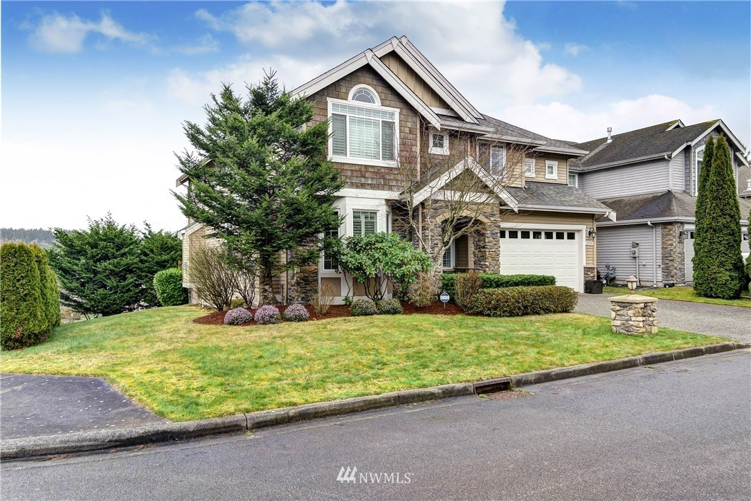 23531 19th Place West Bothell, WA 98021 - Photo 1 of 1 a front view of a house with a yard and garage
