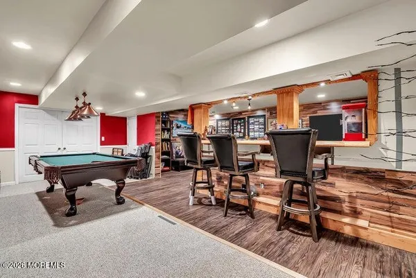 a room with furniture and a wooden floor