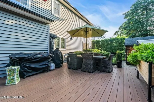 a view of a backyard with sitting area