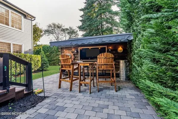 a view of an chairs and tables in the patio