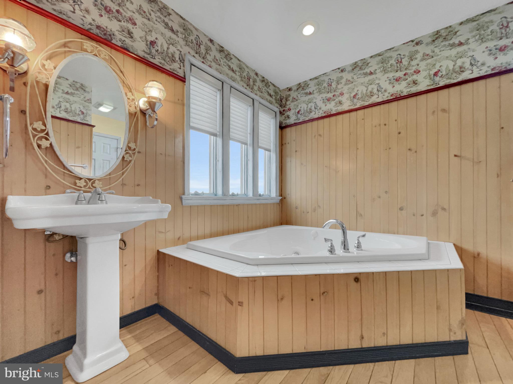65 South Reamstown Road Stevens, PA 17578 - Photo 13 of 32 a bathroom with a sink a mirror and a bathtub