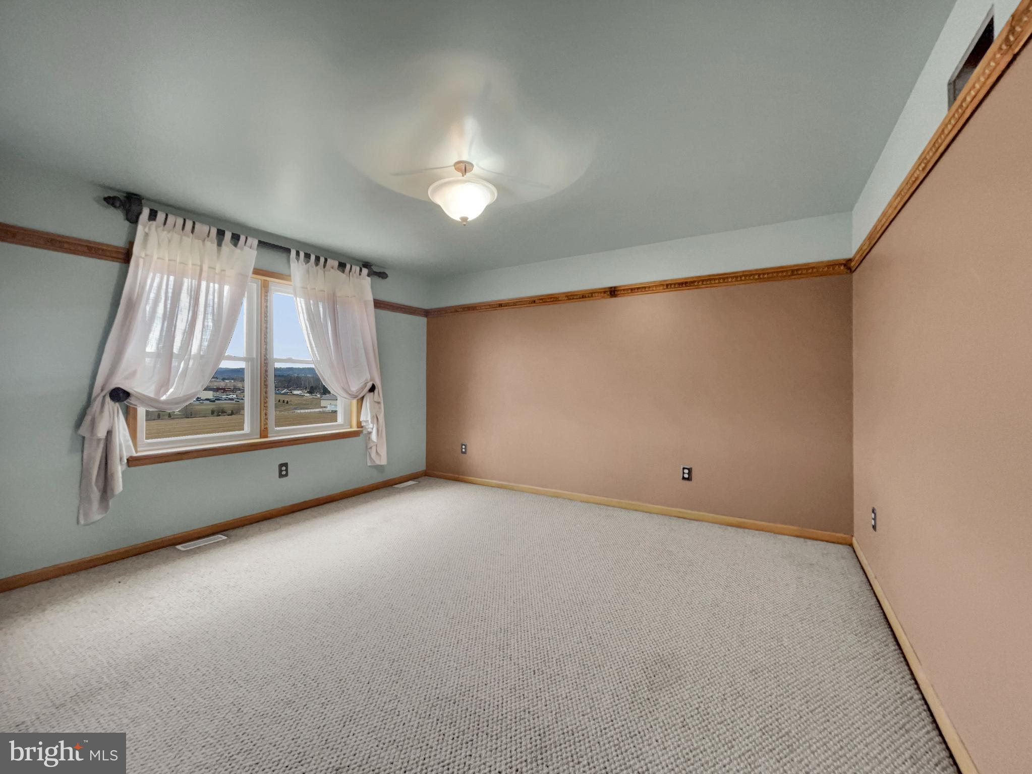 65 South Reamstown Road Stevens, PA 17578 - Photo 21 of 32 an empty room with a fireplace and windows