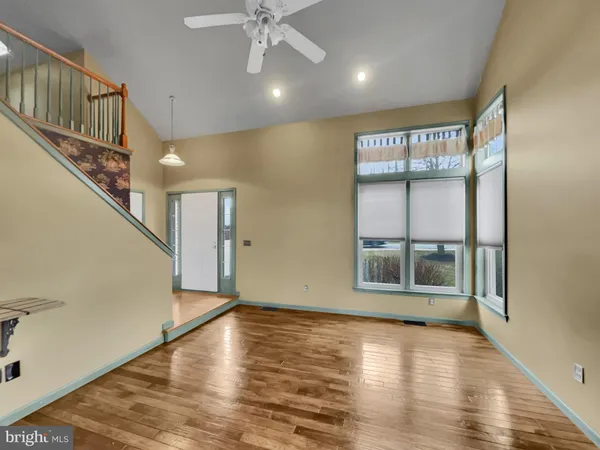 a view of an entryway with wooden floor