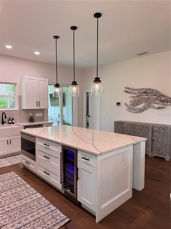 4275 Beacon Light Road Edgewater, FL 32141 - Photo 23 of 48 a kitchen that has a lot of cabinets in it