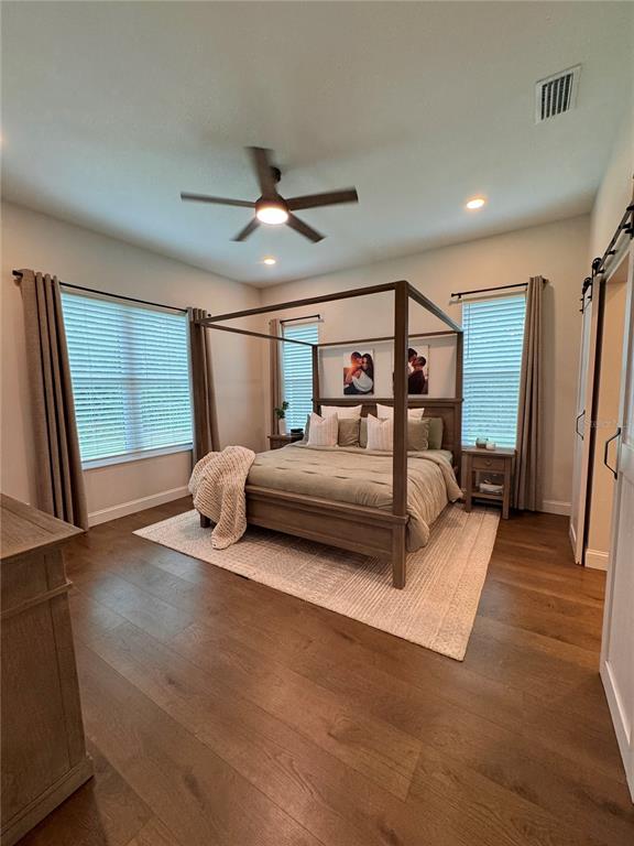 4275 Beacon Light Road Edgewater, FL 32141 - Photo 30 of 48 a living room with a bed furniture and a large window
