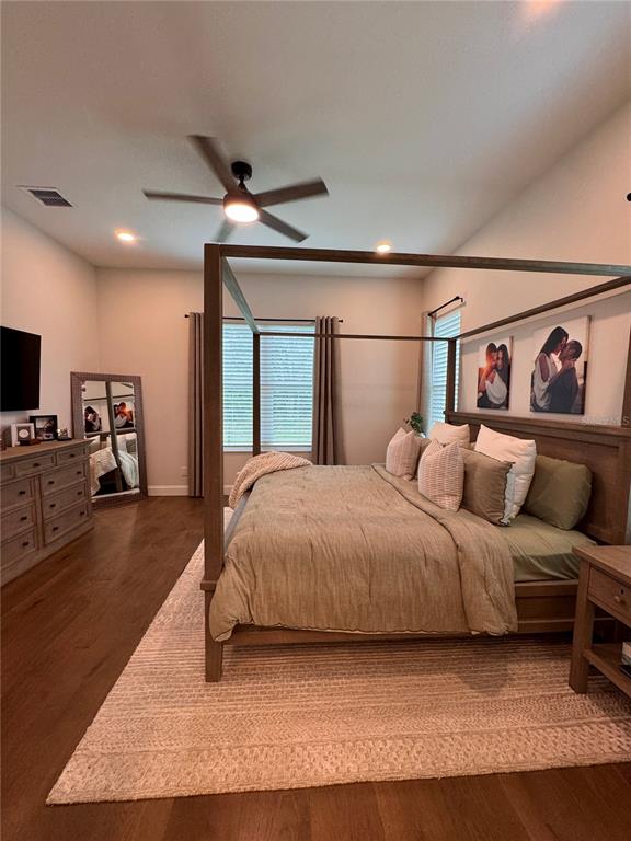 4275 Beacon Light Road Edgewater, FL 32141 - Photo 32 of 48 a bedroom with a large bed and a flat screen tv