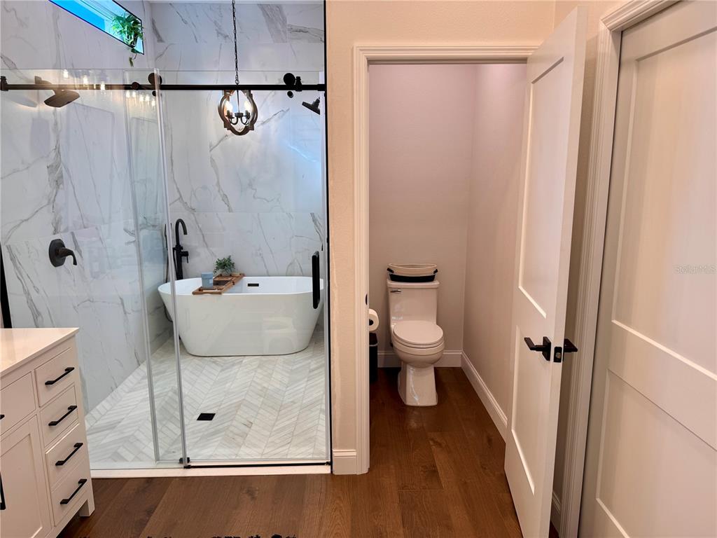 4275 Beacon Light Road Edgewater, FL 32141 - Photo 33 of 48 a bathroom with a sink a toilet and shower