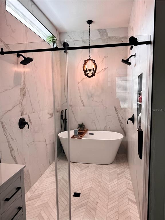 4275 Beacon Light Road Edgewater, FL 32141 - Photo 34 of 48 a bathroom with a bathtub and shower