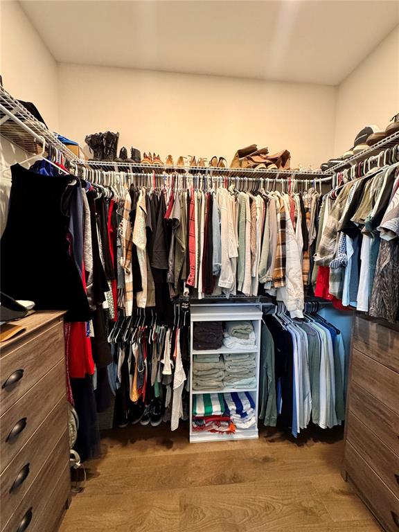 4275 Beacon Light Road Edgewater, FL 32141 - Photo 39 of 48 a view of walk in closet with clothes and shoes