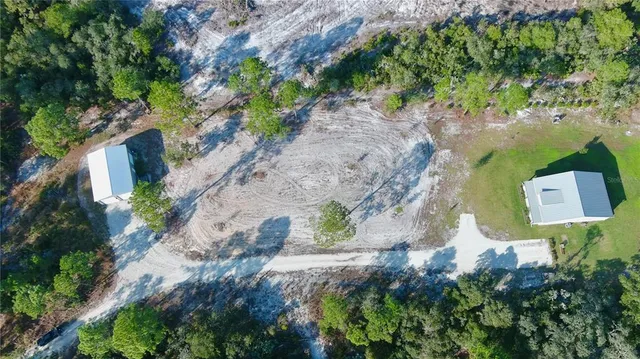 a large kitchen with a table and chairs