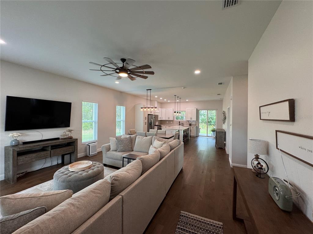 4275 Beacon Light Road Edgewater, FL 32141 - Photo 10 of 48 a living room with furniture and a flat screen tv