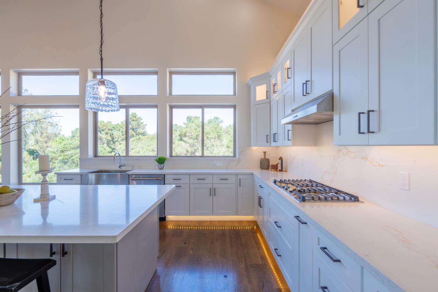9020 Hidden Canyon Road Salinas, CA 93907 - Photo 22 of 58 a kitchen with a stove a sink and a wooden floors