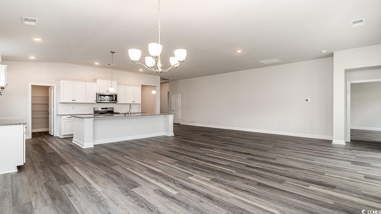 115 Rnch Hvn Drive Murrells Inlet, SC 29576 - Photo 4 of 25 Kitchen featuring white cabinets, pendant lighting