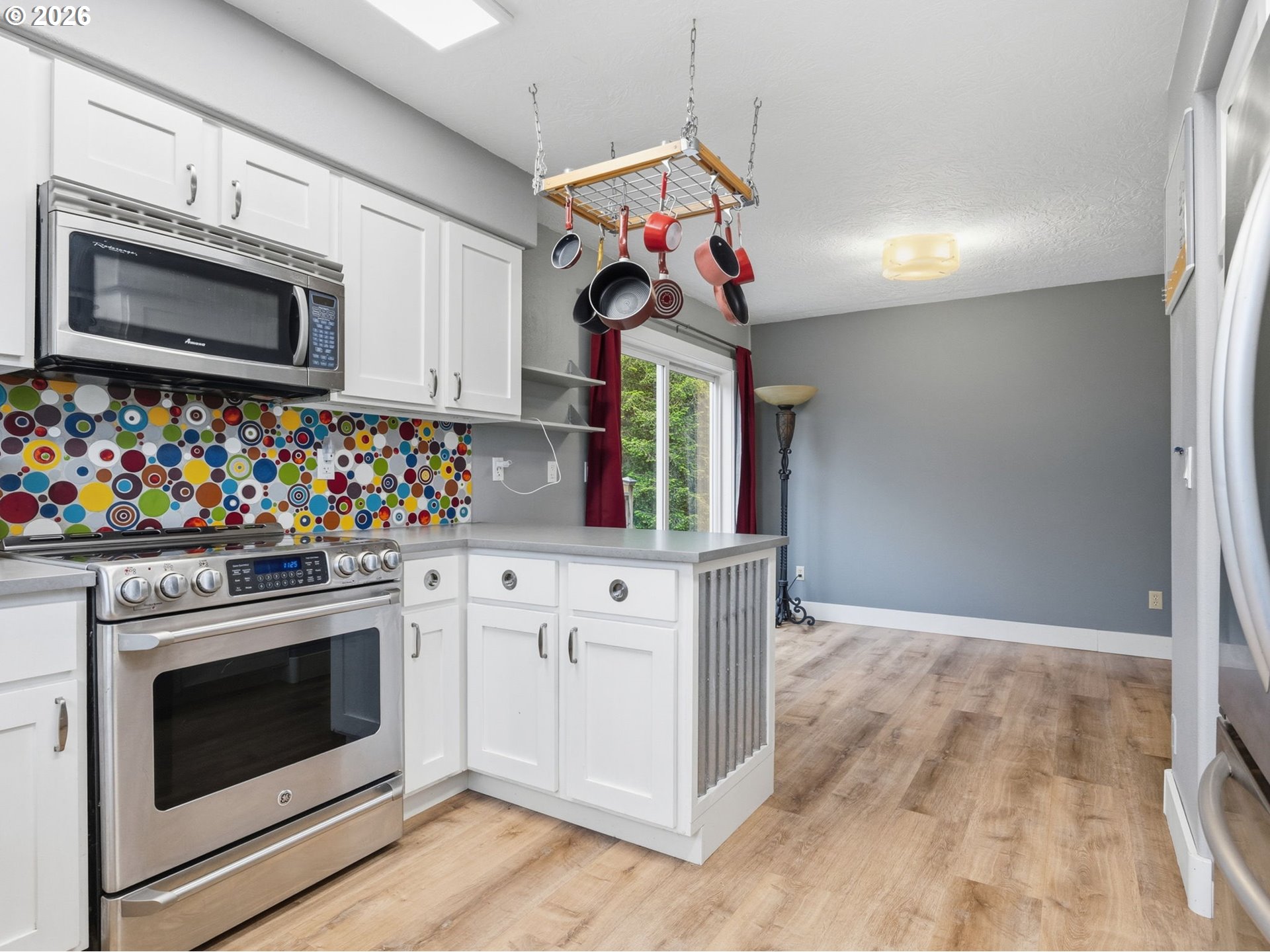 92085 Akerstedt Road Astoria, OR 97103 - Photo 14 of 48 a kitchen with stainless steel appliances granite countertop a stove microwave and cabinets