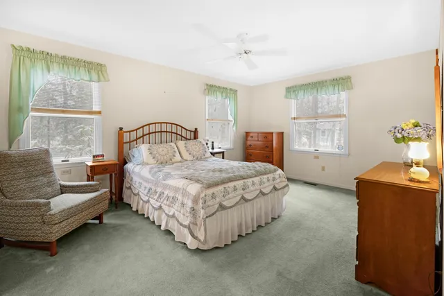 a bedroom with a bed and window