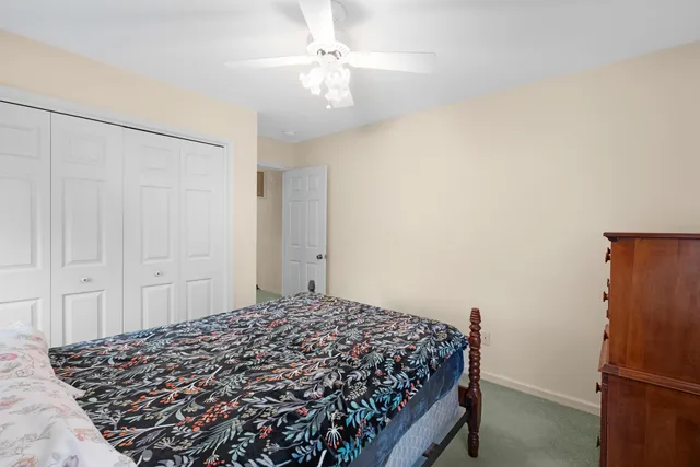 a bed room with two bed and a chandelier