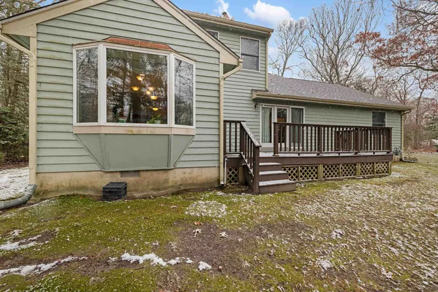 a balcony with wooden floor and fence