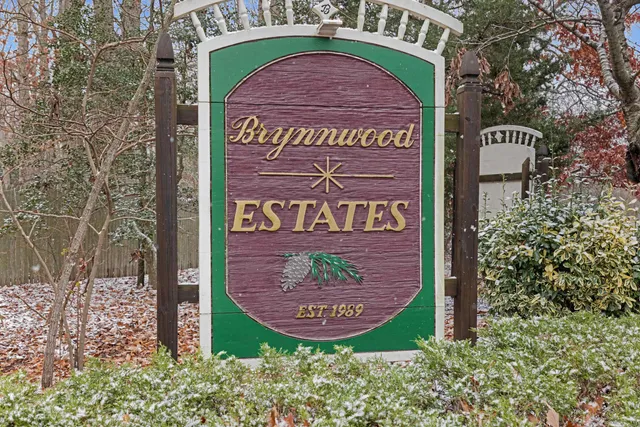 a view of a brick house with a large window