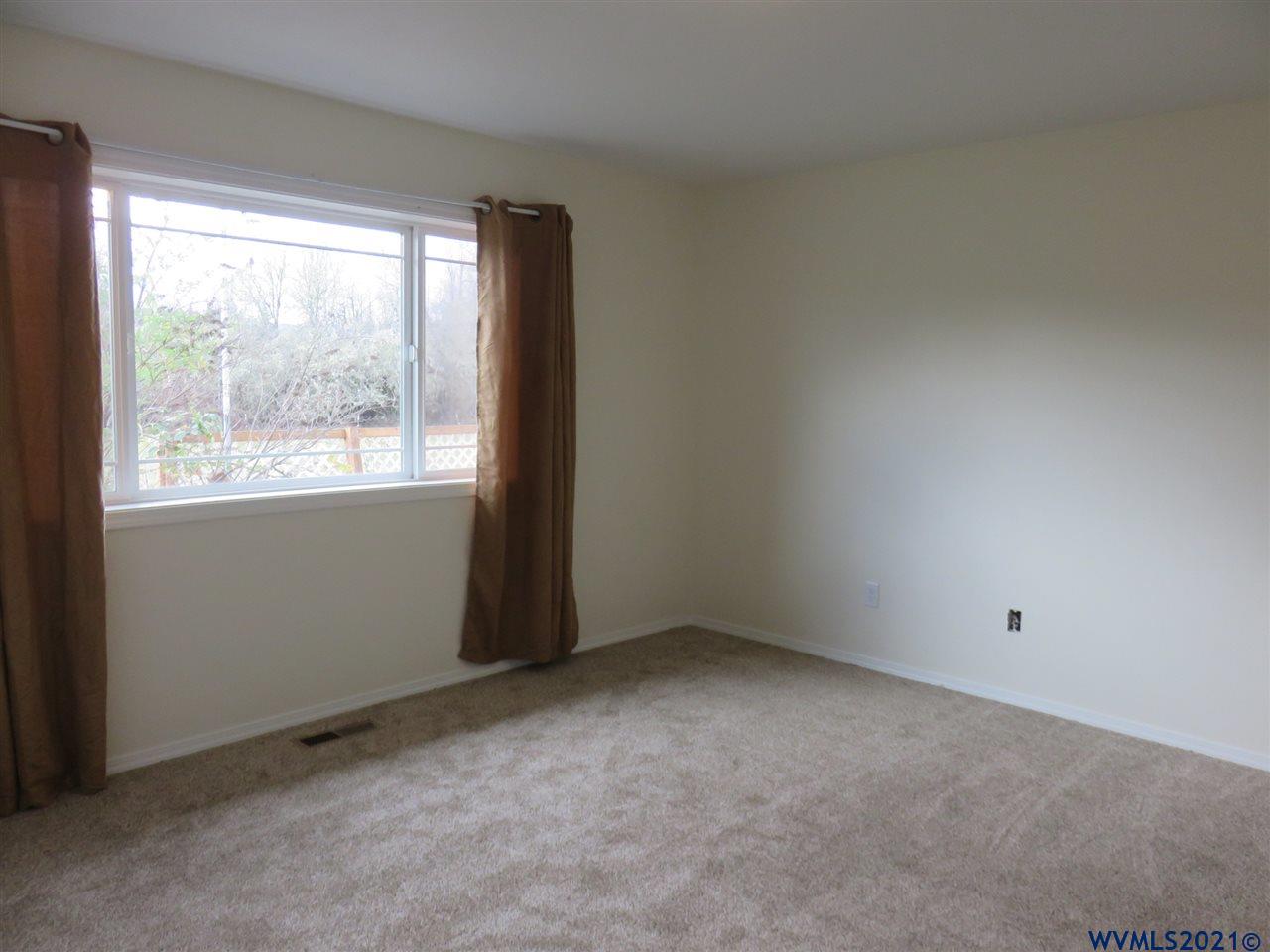 18990 Falls City Road Dallas, OR 97338 - Photo 16 of 42 an empty room with a window