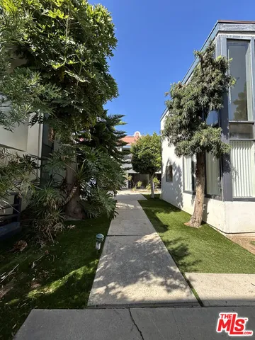a view of a street with a building in the background